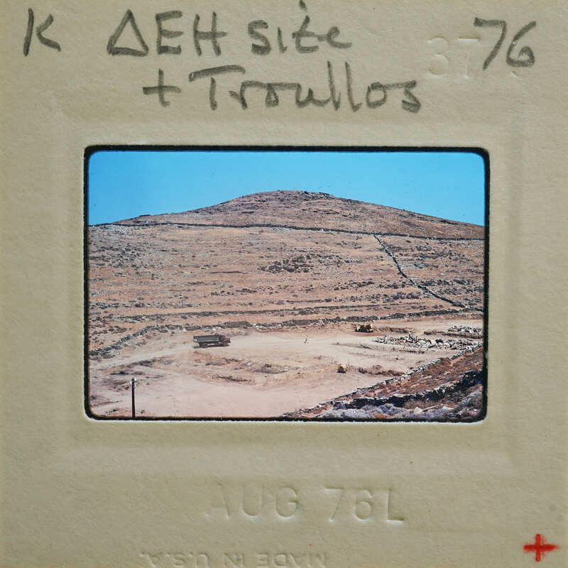 A photograph of a desert landscape with a mountain range, taken on August 7, 1976.