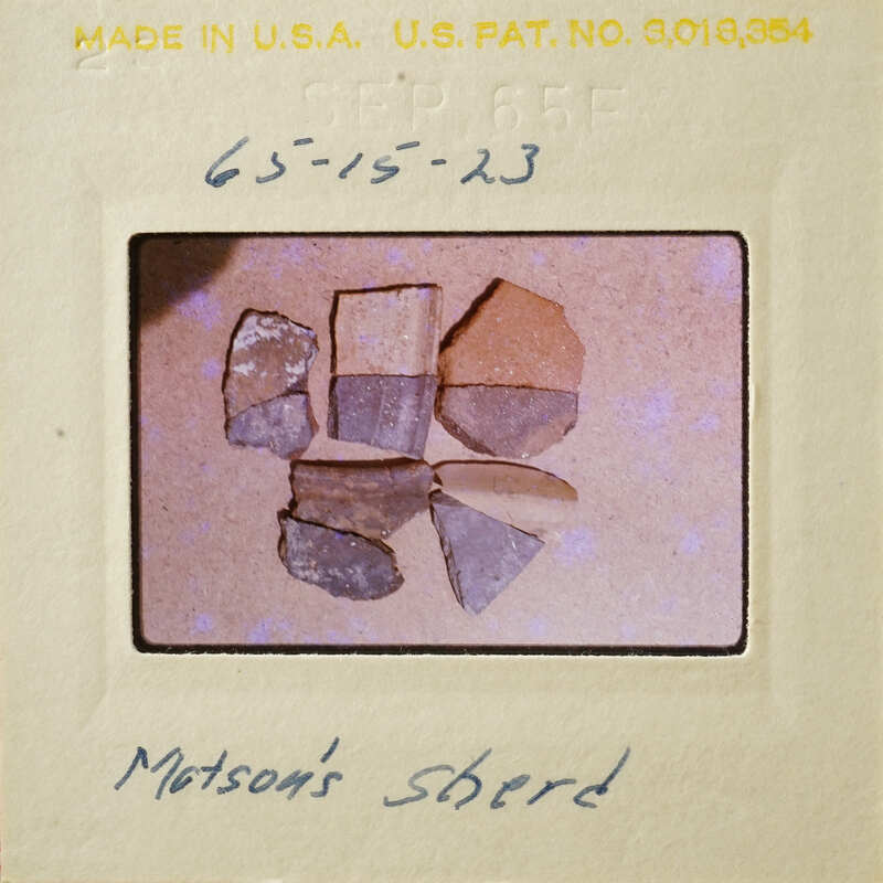 A collection of multicolored rocks on a surface.