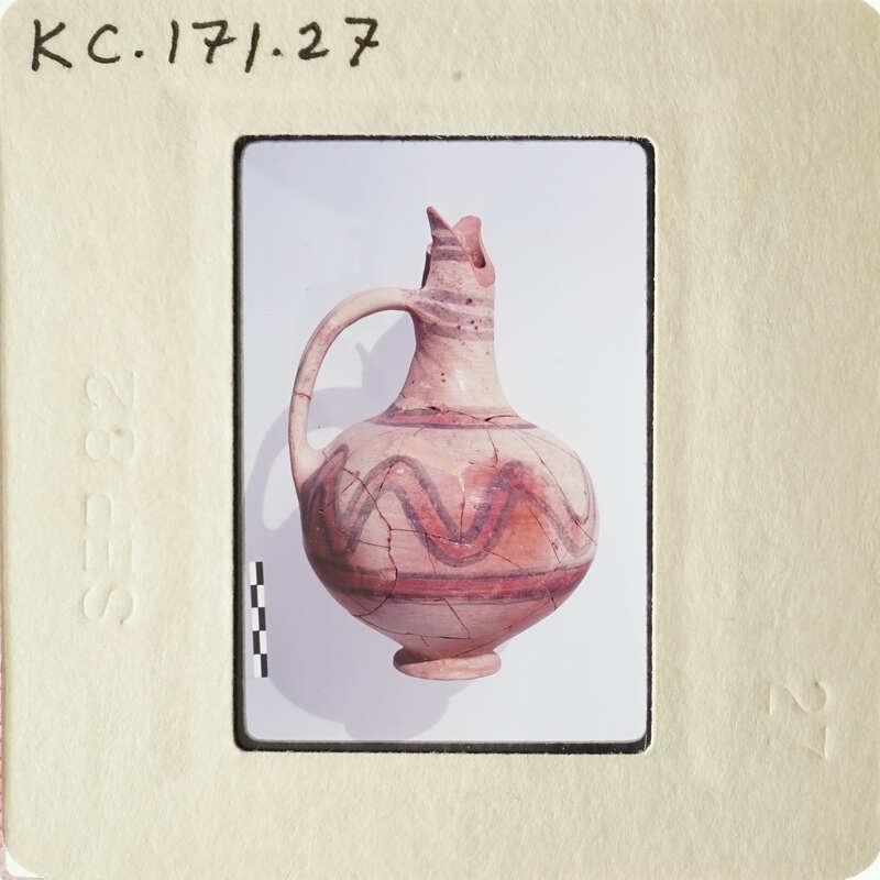 Ancient pottery displayed on a white background, with visible cracks and patterns.