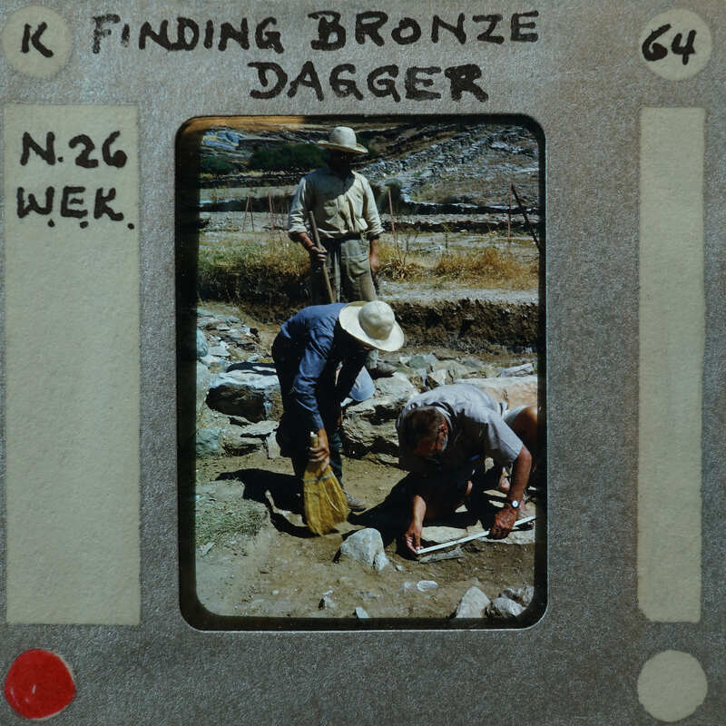 Men working on an archaeological dig, searching for bronze dagger artifacts.