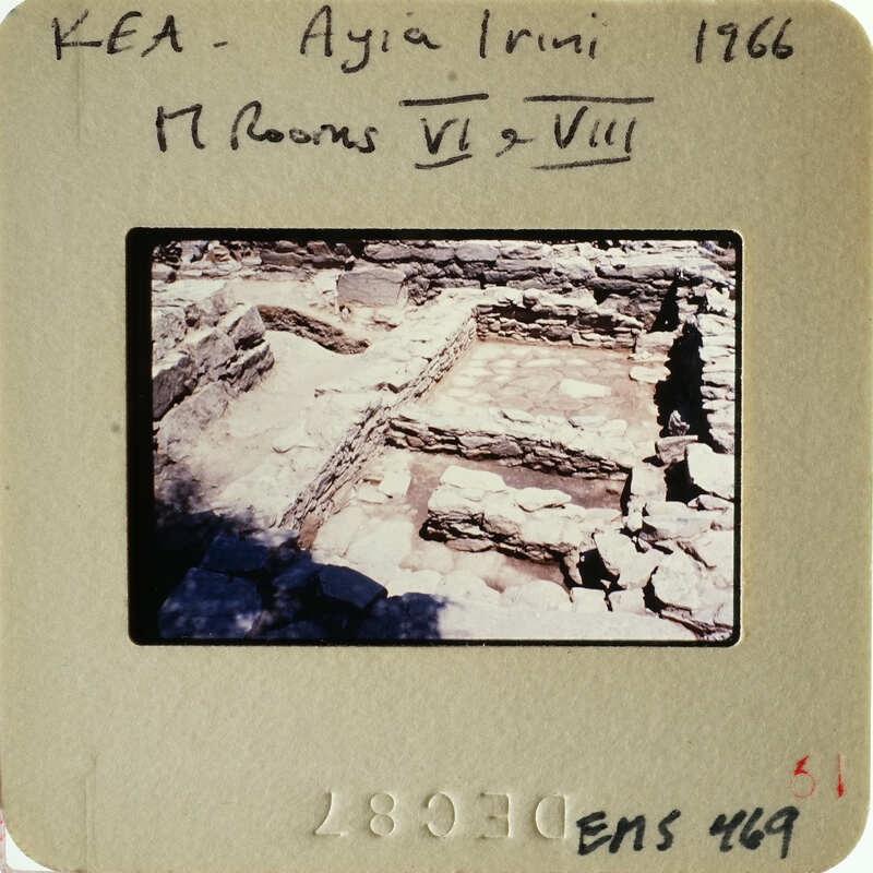 Ancient ruins with stone walls and foundations, possibly part of an archaeological site.