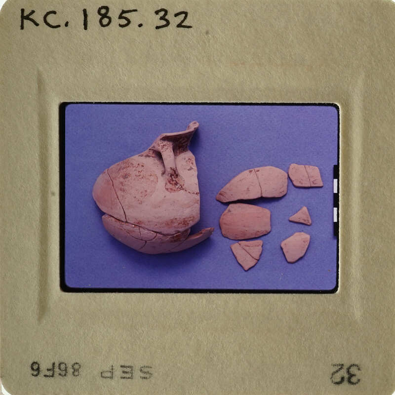 Ancient pottery shards on a blue background.