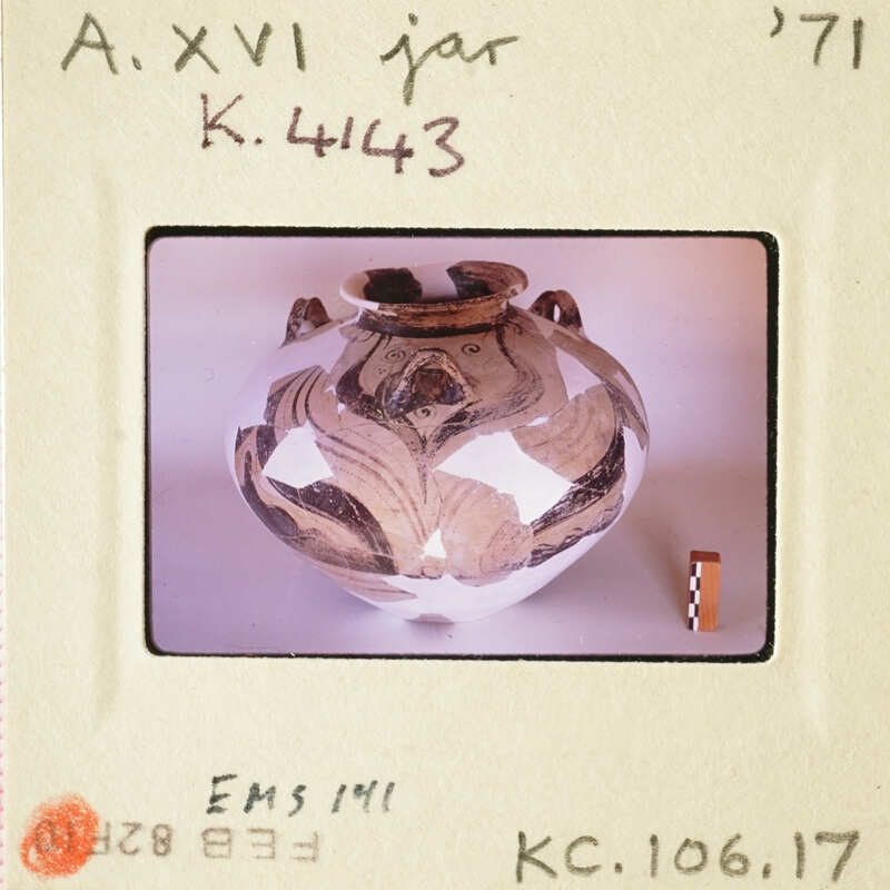 Ancient Greek vase with intricate designs on display.