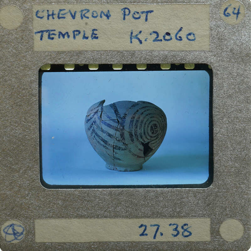 Partially reassembled pot with circular and chevron painted decoration K.2060.