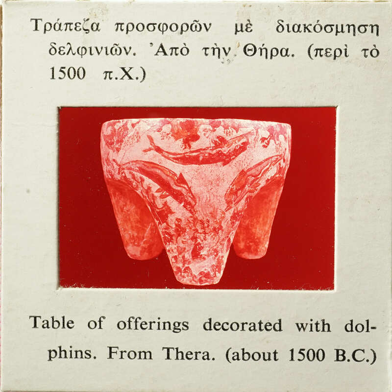 Three legged table with fish decoration, likely from ancient Thera circa 1600 BCE.