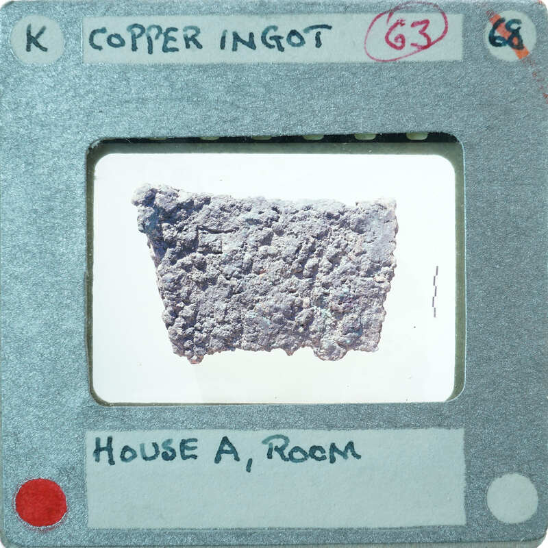 Large lumpy of shaped metal with attached label,:possibly from "House A Room".