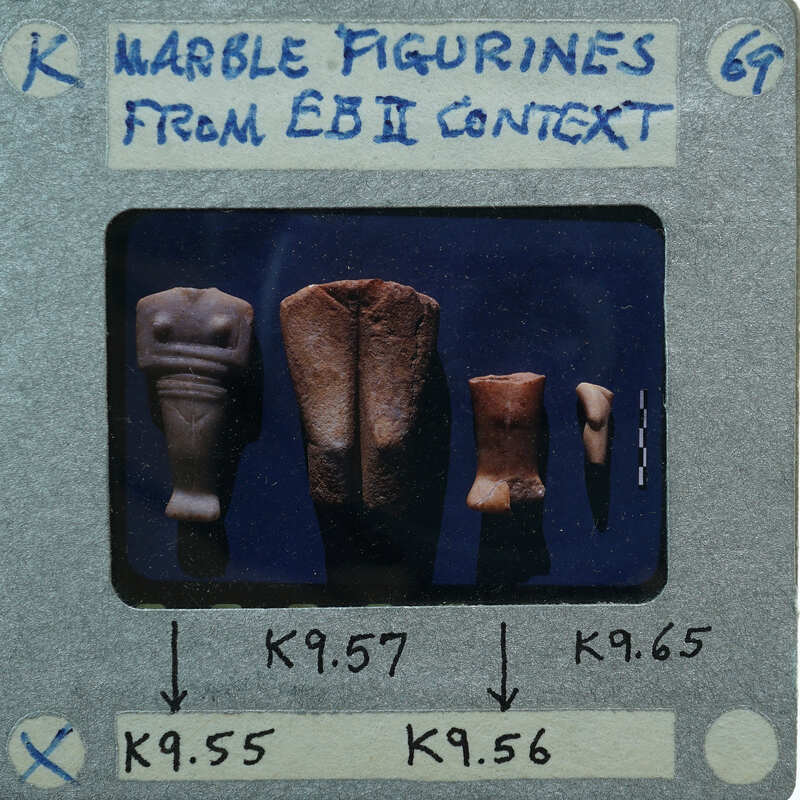 Various marble figurine body fragments, torso, legs, back, leg.