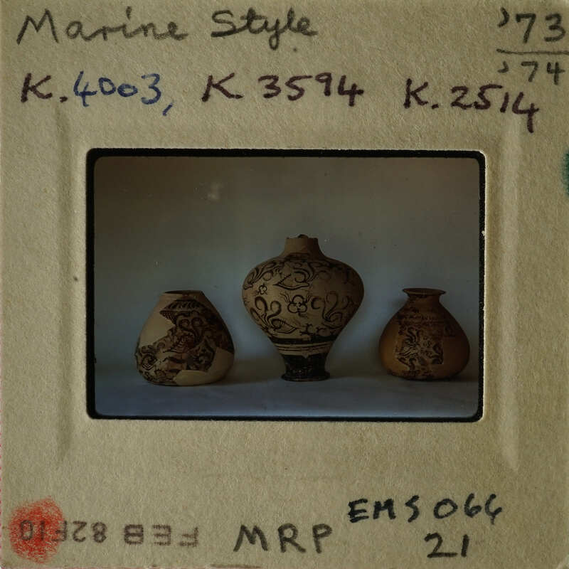 Three decorative vases on display.