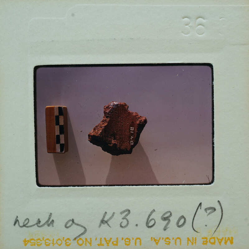 A photograph of a rock specimen with an annotation on the negative.