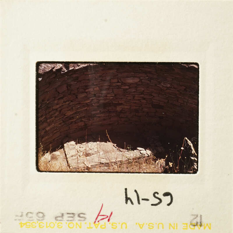 Ancient stone structure with sunlight streaming through an opening.