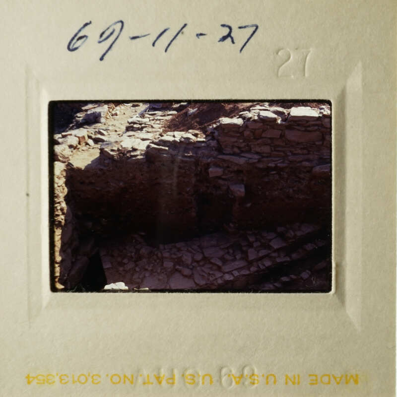 The image shows an ancient stone structure, possibly ruins, with a perspective view from above.