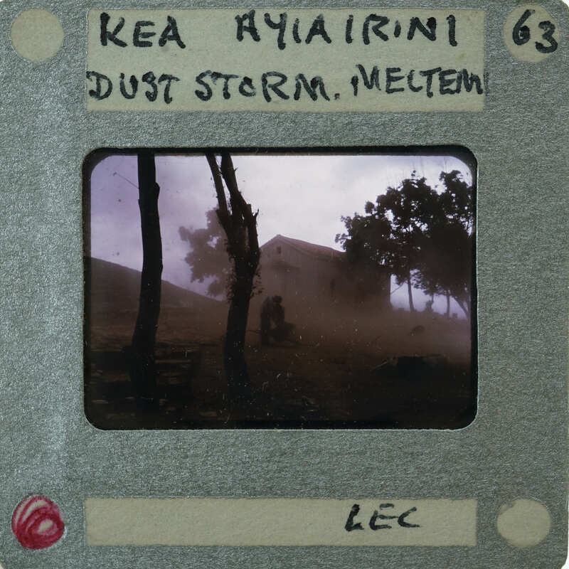 A photograph of a dust storm with trees and buildings, labeled "Kea Ayaireni" and "Just Dust Storm, Meltem".