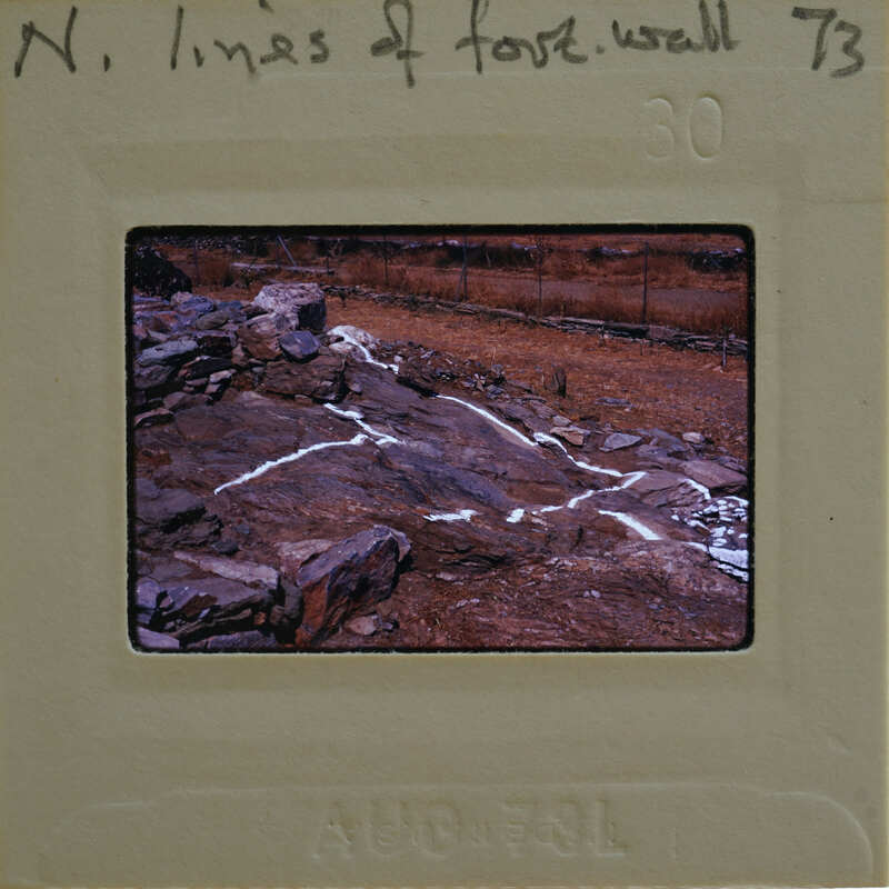 Image of a film strip with a picture of rocks and dirt on it.