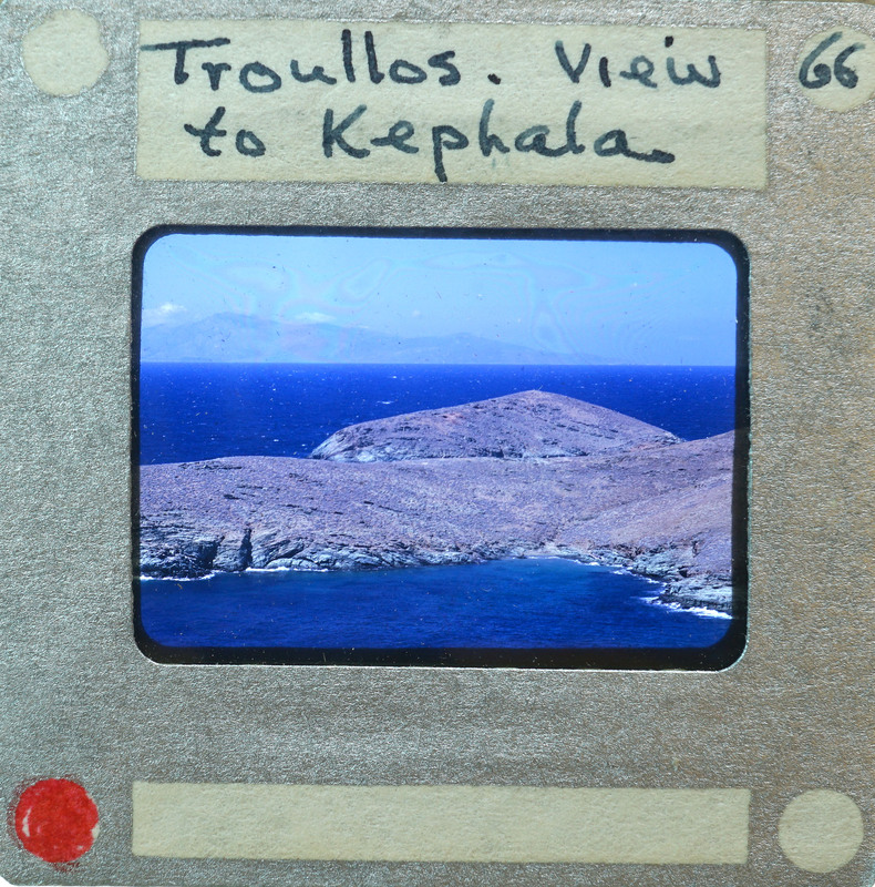 Picture of a scenic view with a body of water and an island, labeled as "View to Kephala" on the front of a film strip.