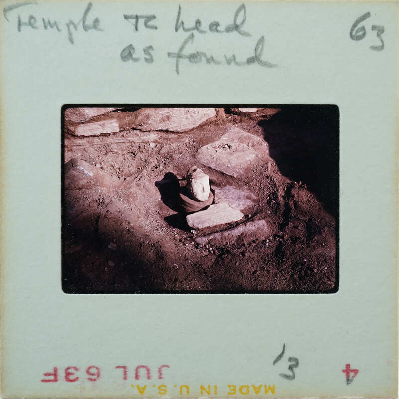 Detail of terracotta head on floor.