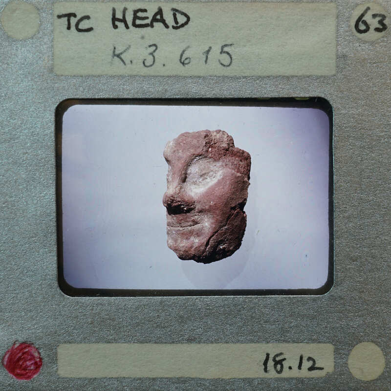 Terracotta figurine face fragment from front K3.615.