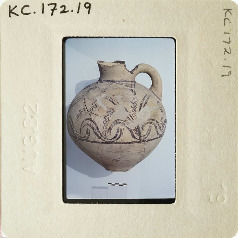 Ancient vase with intricate designs on display.