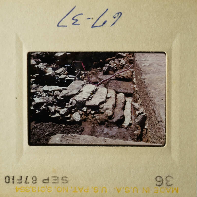 The images show two different views of an archaeological site with stone ruins and rubble.