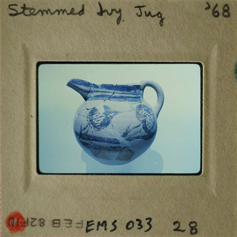 An antique blue and white vase with floral designs.