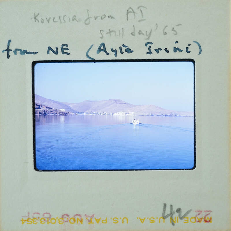 Postcard with a photo of a calm sea and mountains, sent from Kiev to NE (New England) by Aya Trini.