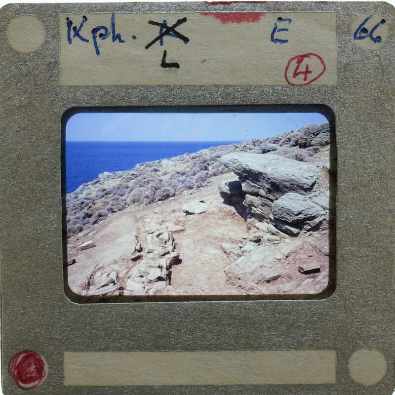 An old slide with a picture of an ancient archaeological site by the ocean.