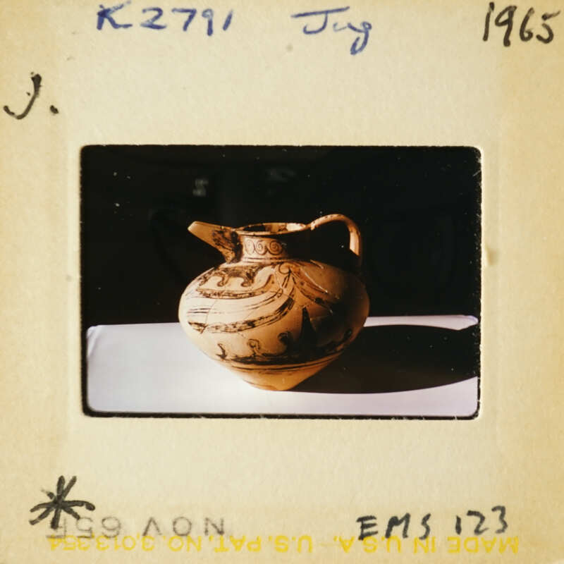 Ancient Greek vase with intricate designs on display.