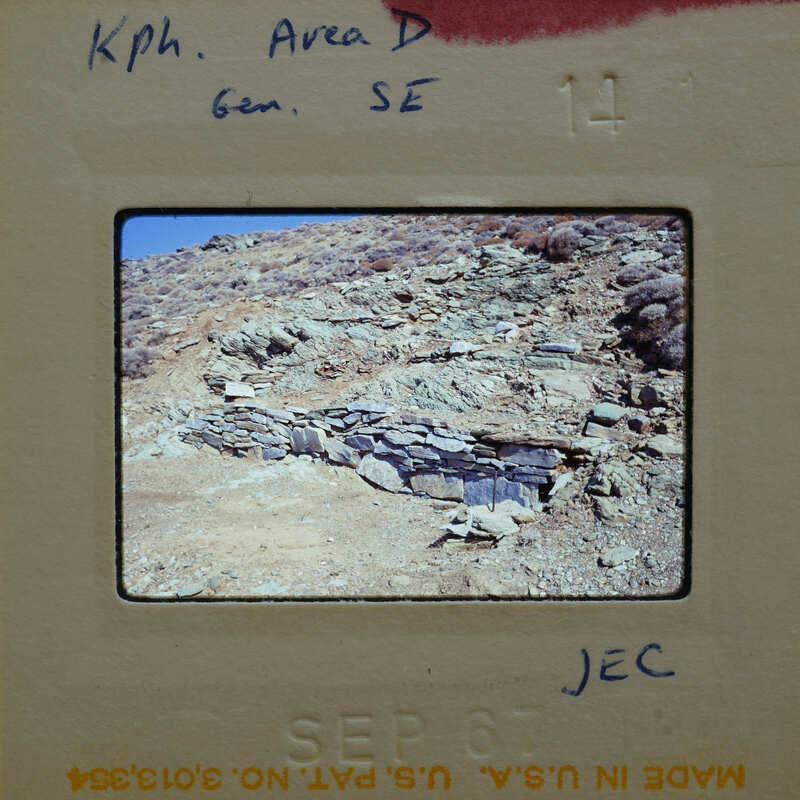 Slide of a rocky mountain landscape with a small cave or overhang.