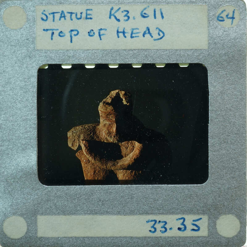 Detail of head of complete terracotta figurine from the top.