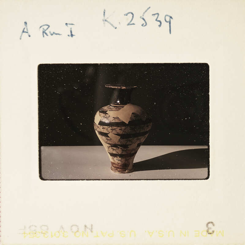 A photograph of a vase with an abstract pattern on it.