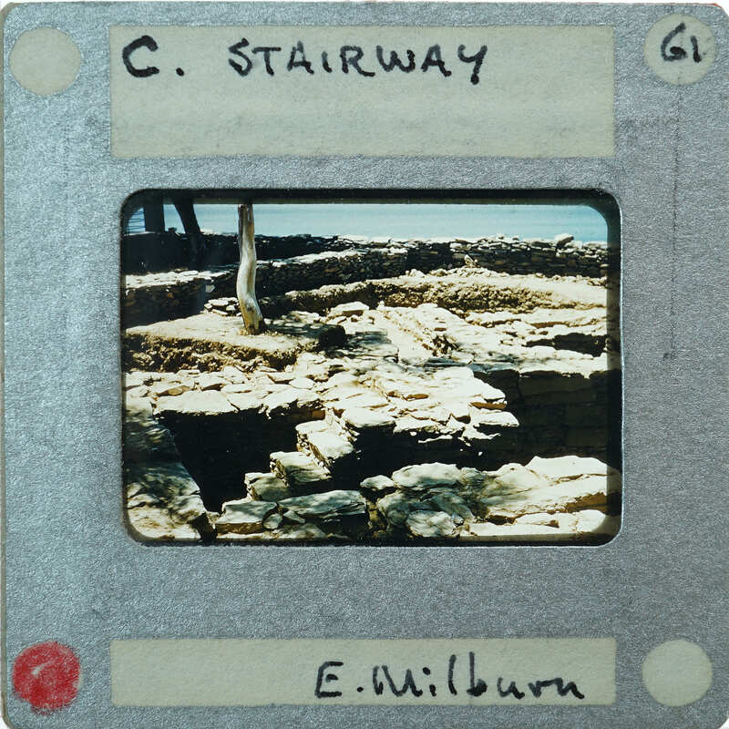 A photograph of a stone staircase with an old, weathered appearance.