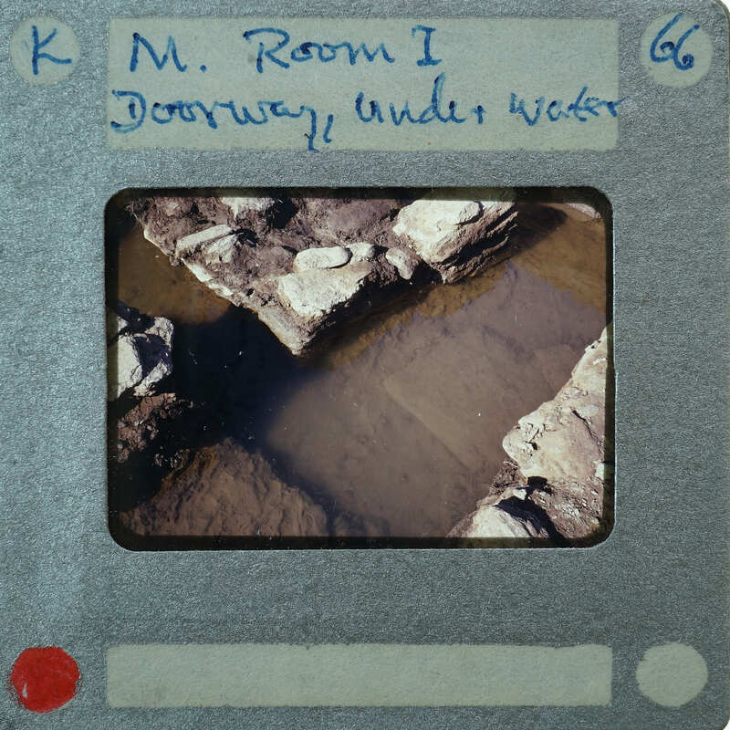 A photograph of a rocky underwater environment with annotations on its border.