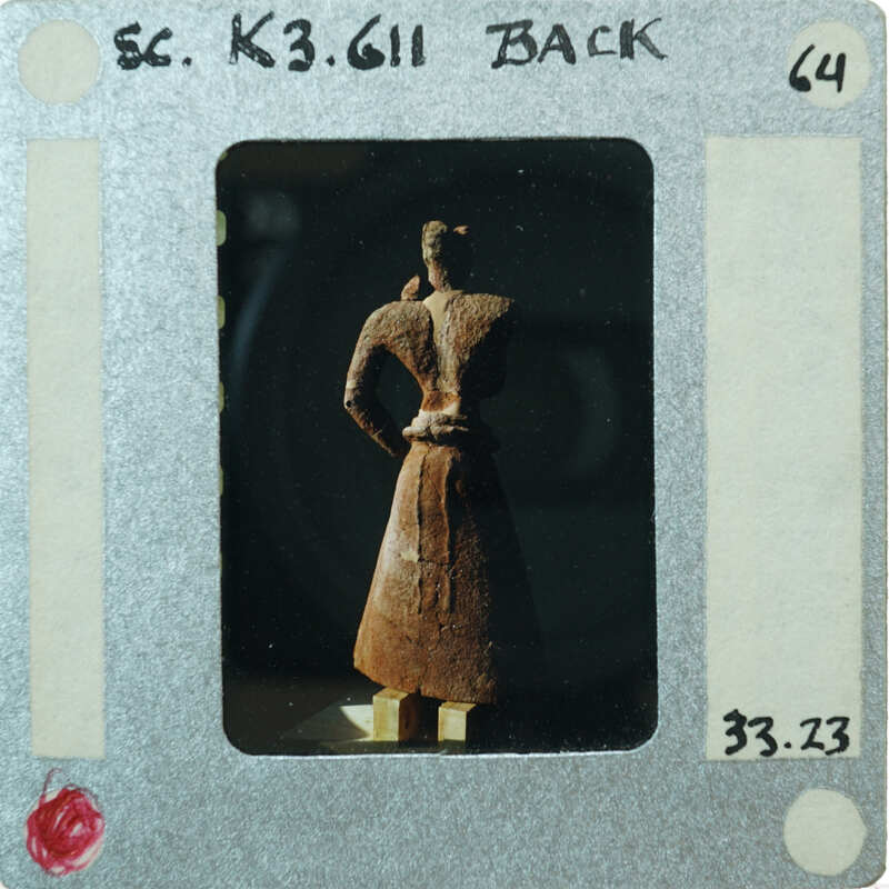 Almost complete terracotta figurine from the back minus right arm.