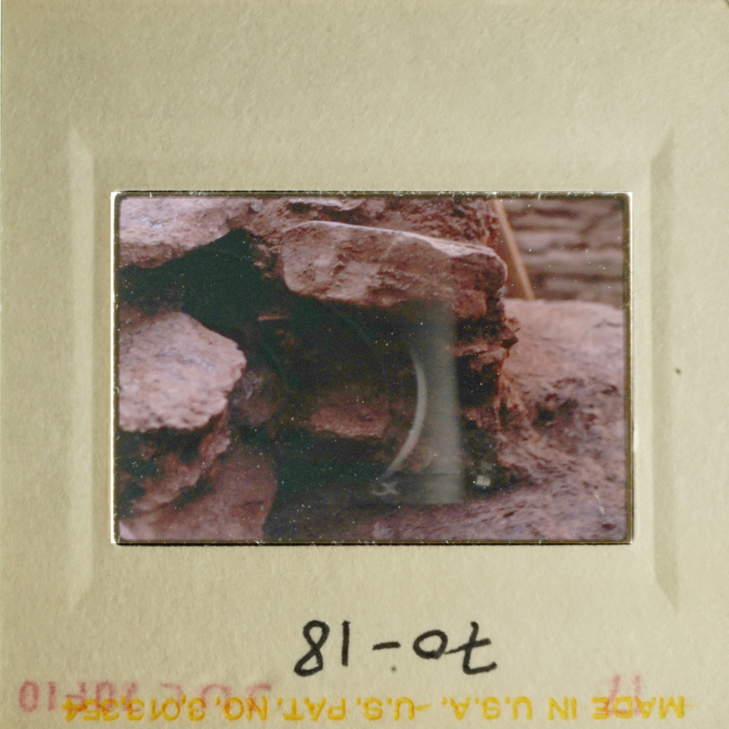 A photo of a rocky landscape with a small hole in the center.