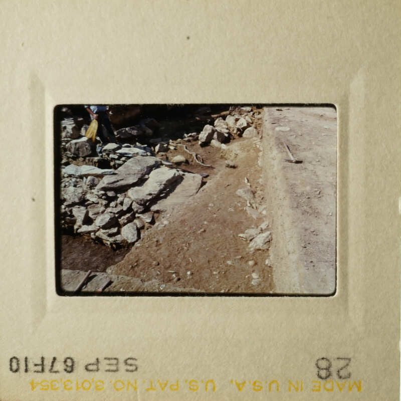 Two photos depicting a construction site with dirt and rocks, showing progress over time.