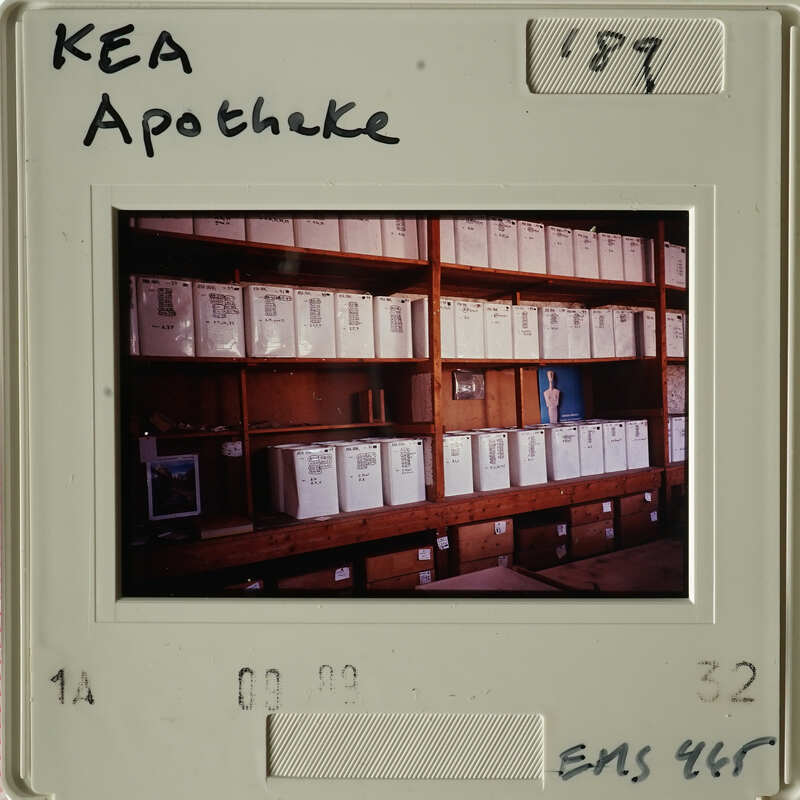 Old photo showing rows of boxes on shelves.