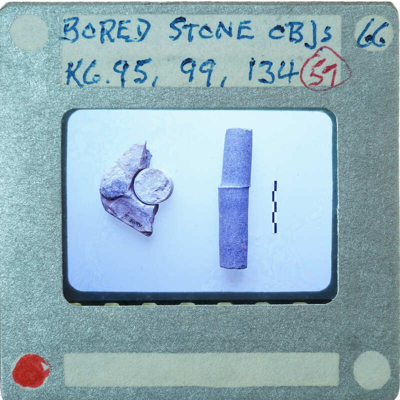 Three broken stone objects on table, K6.95, K6.99, K6.134.