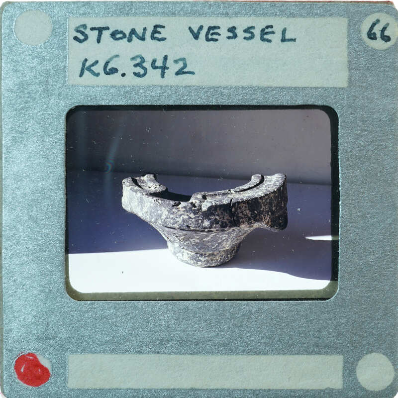 A stone vessel fragment with rim from side, K6.342.