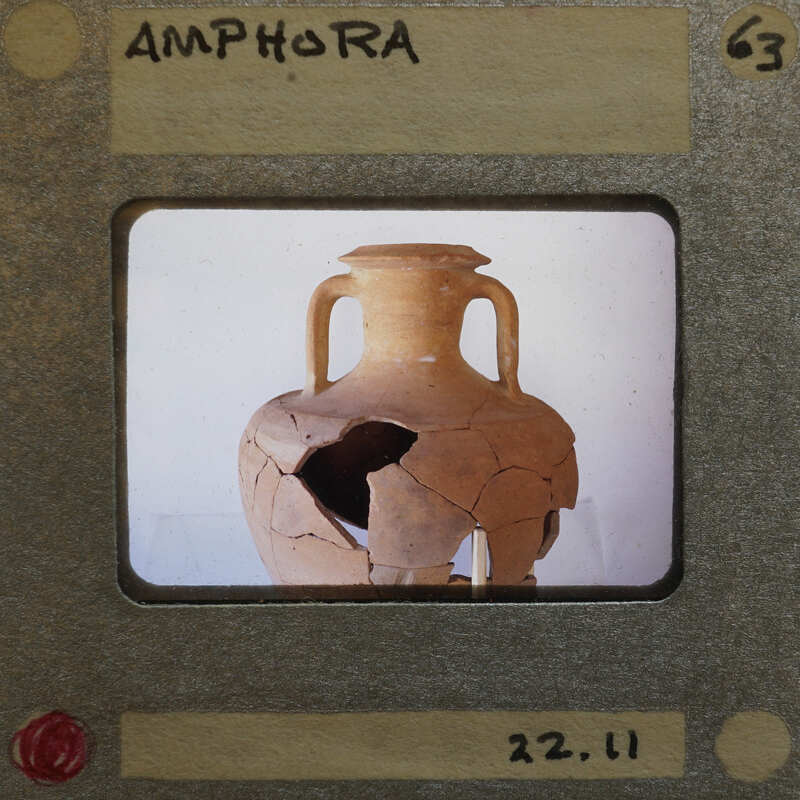 Partially reassembled two handled amphora in profile.