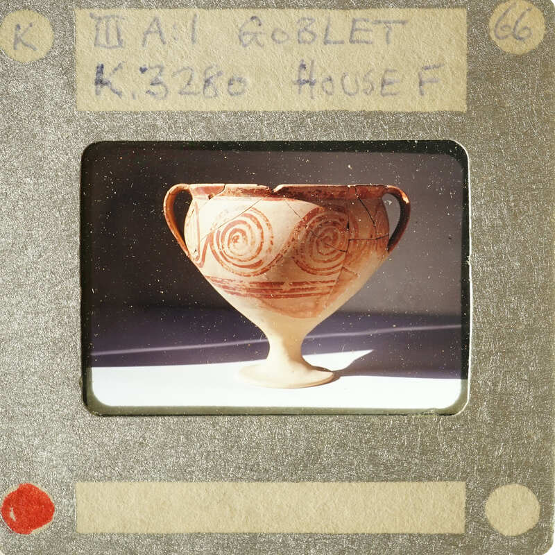 Ancient Greek vase with swirling patterns.