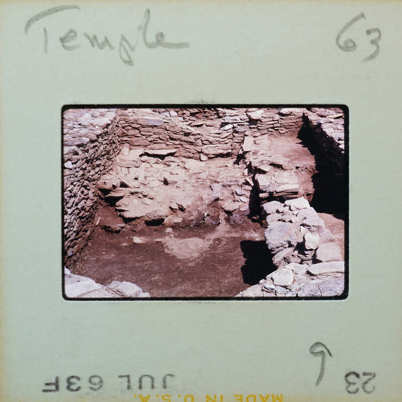 Detail of interior of stone walled room, partially under water.