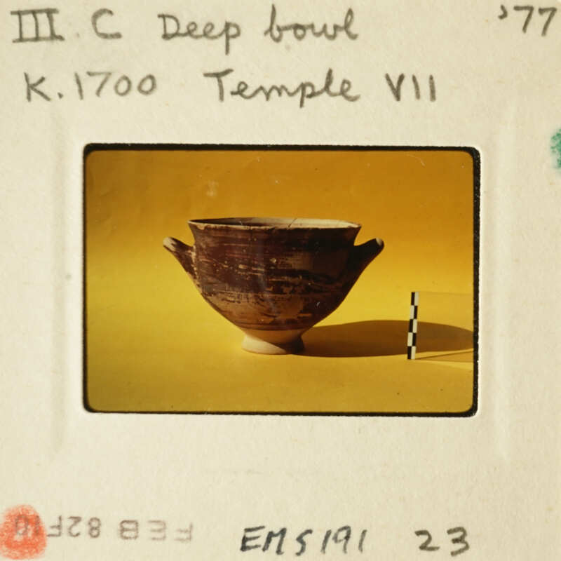 Ancient Greek vase on yellow background.