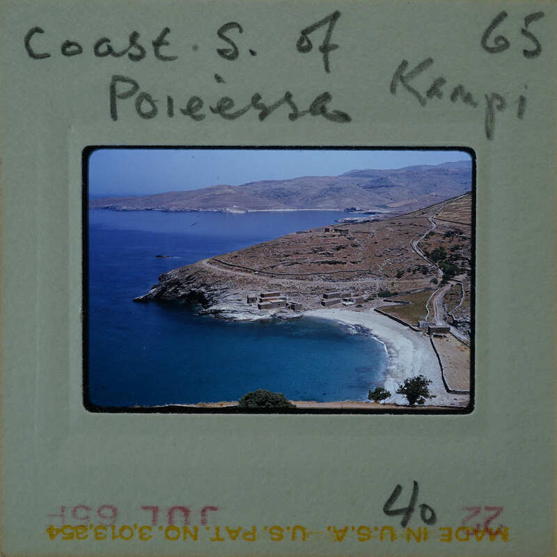 A vintage postcard depicting a coastal scene with blue waters and mountains, featuring the title "COAST S. OF KEPPI" written on it.
