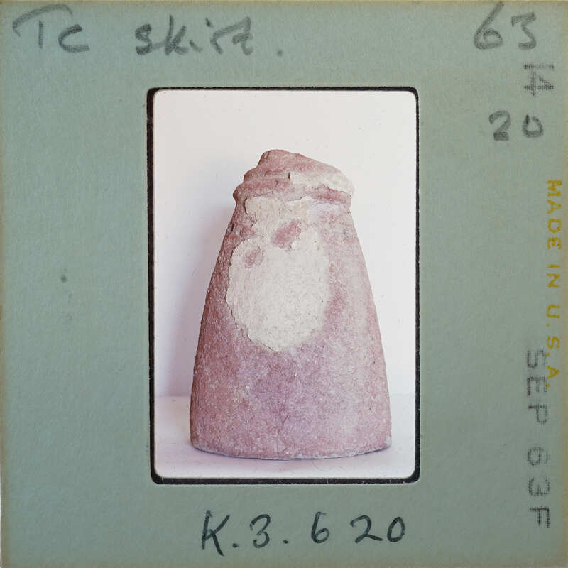 Terracotta figurine detail showing skirt.