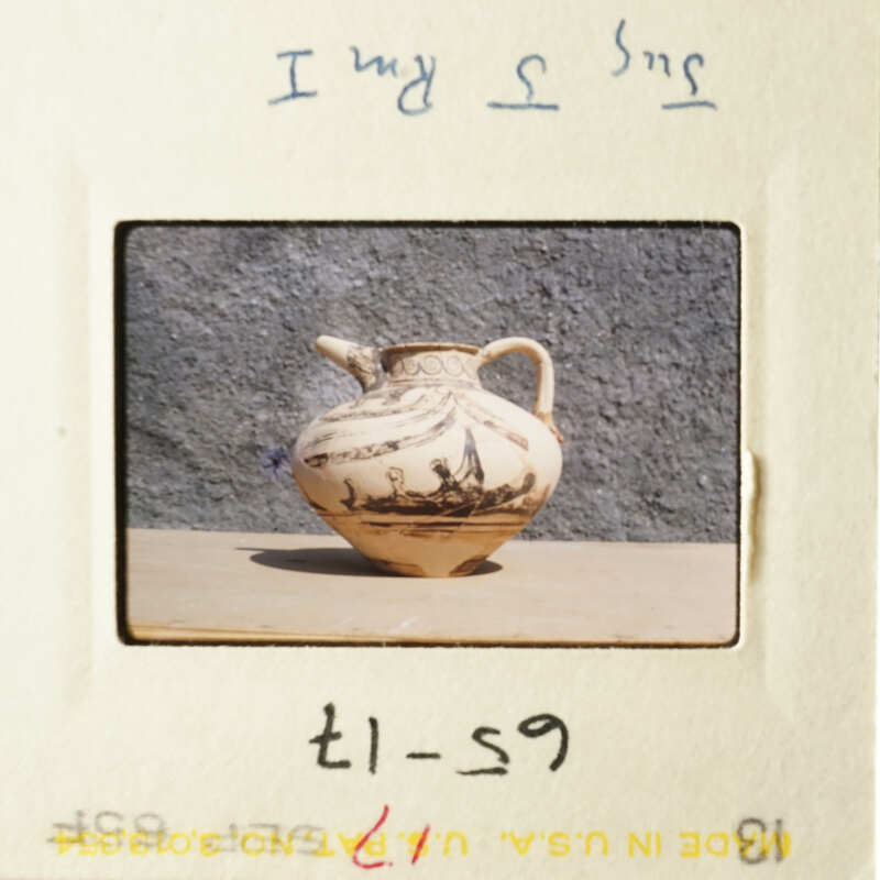 A vase with a floral pattern on it.