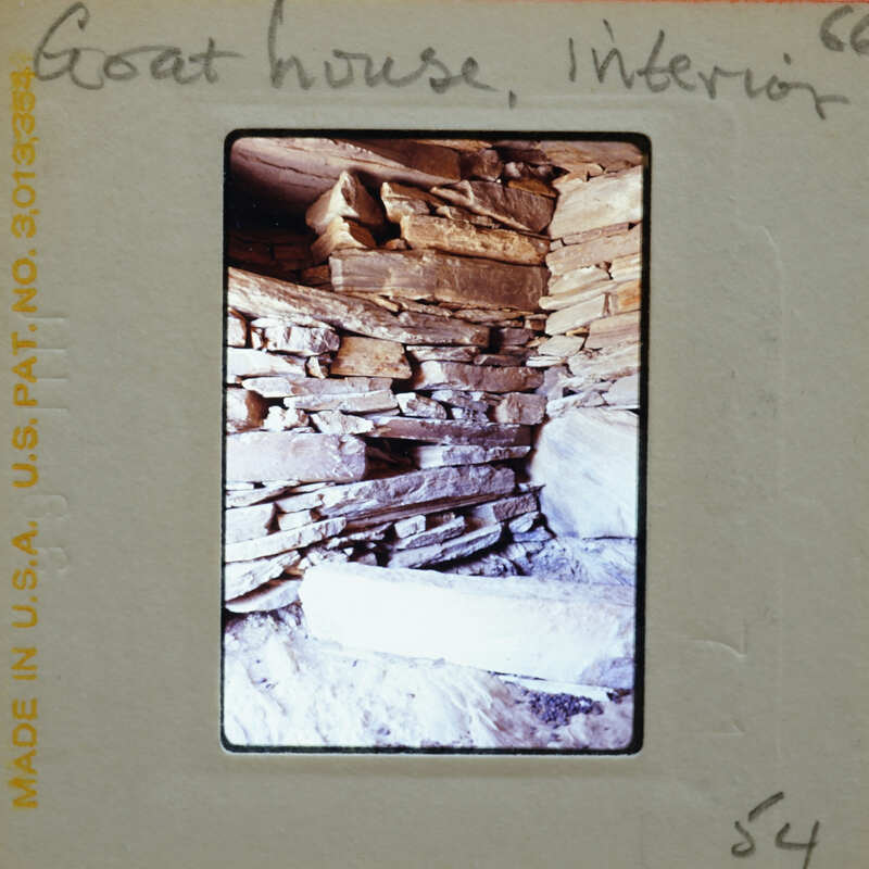 Stone-walled room interior.