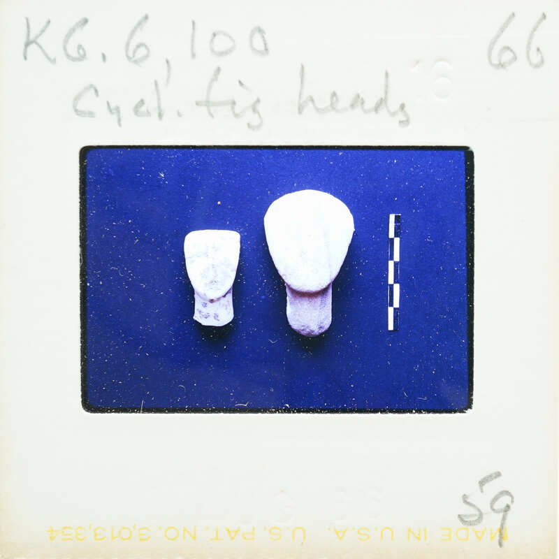 Two stylized marble faces on blue screen.