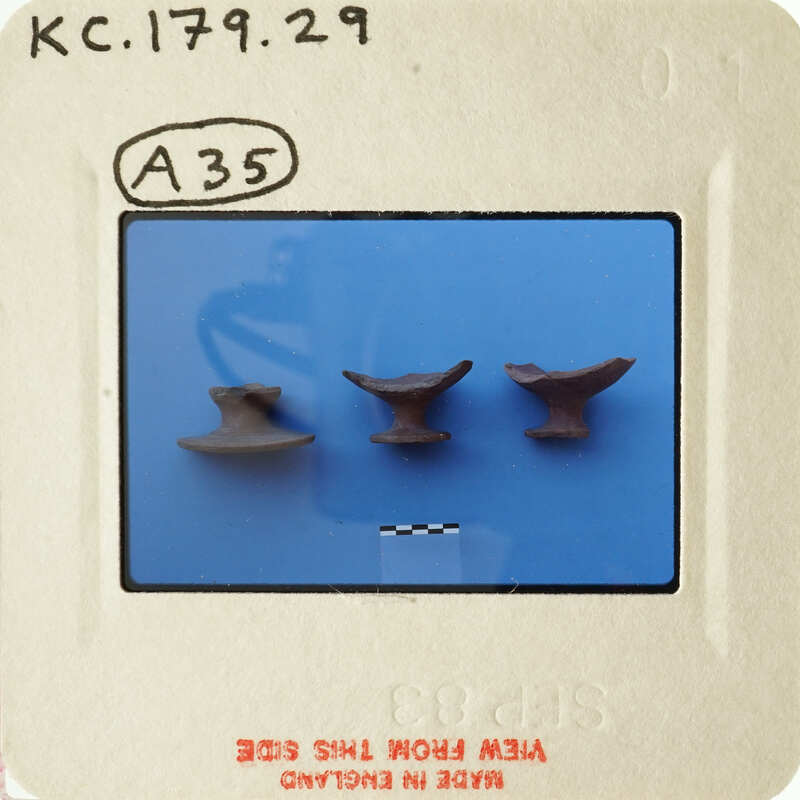 Five metal objects on blue background with white border and handwritten label.