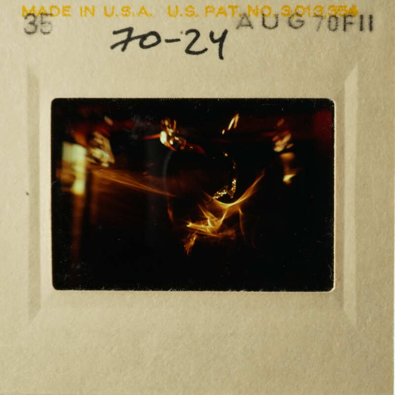 A vintage photo of a dog on a leash, captured in black and white.