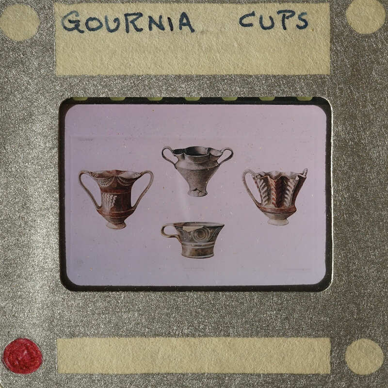 Old photos of ancient Greek vases on display.