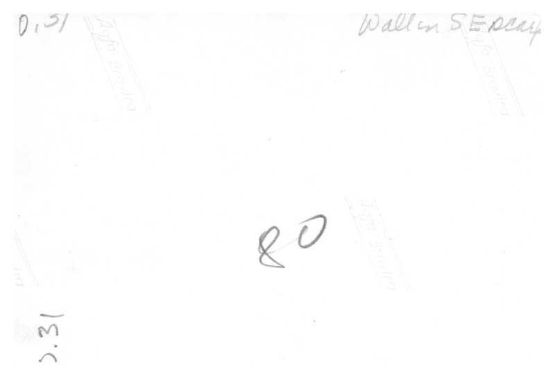 A blurred and faded photograph with handwritten text on it.